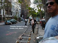 Timothy Hutton working on production (in cream suit, up the block)