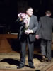 Nero Wolfe with the orchids he brought from the plant rooms